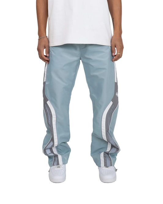 Light blue pants with white stripes worn by a person on a white background